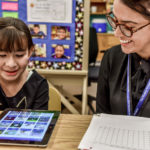 student-mentor Student reading with a Shadow Project mentor
