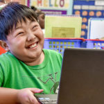 eric-smiling-in-the-classroom-c Shadow Student Smiling in the Classroom