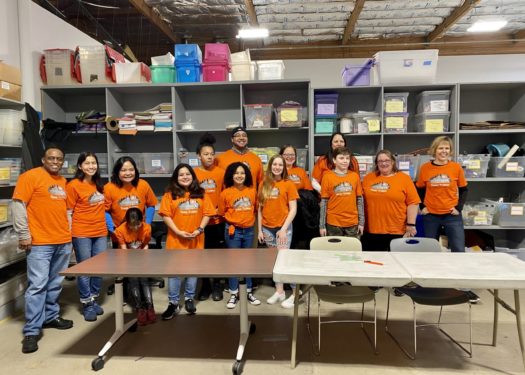 Trimet employees and their families volunteer to pack supplies for teachers