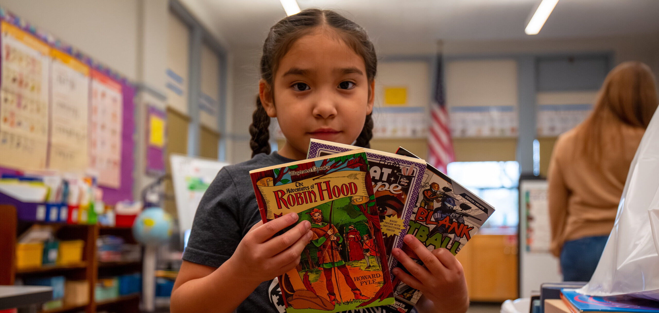 a student holding books
